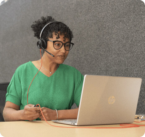 Woman holding and Ipad and smiling